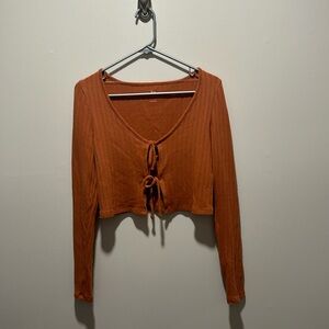 Juniors SO front tie long sleeve top in size S.